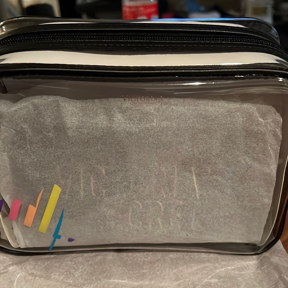 Selling a clear smaller make up bag with two other additional bags